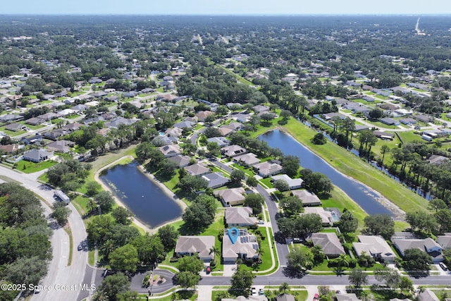 1737 Windbrook Dr SE, Palm Bay, FL 32909 - aerial view of property and surrounding area featuring a large body of water and nearby suburban area