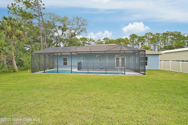 766 Tooley Rd SW, Palm Bay, FL 32908 - back of property with an outdoor pool, glass enclosure, a patio, and stucco siding