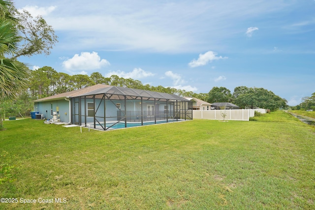766 Tooley Rd SW, Palm Bay, FL 32908 - view of yard featuring a lanai and central air condition unit