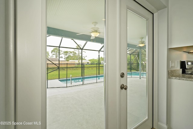766 Tooley Rd SW, Palm Bay, FL 32908 - entryway with a sunroom, ceiling fan, and carpet flooring