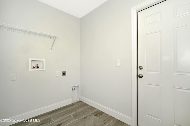 766 Tooley Rd SW, Palm Bay, FL 32908 - washroom featuring electric dryer hookup, washer hookup, baseboards, and light wood finished floors