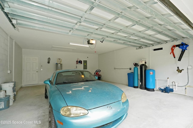 766 Tooley Rd SW, Palm Bay, FL 32908 - garage with electric panel, water heater, and a garage door opener