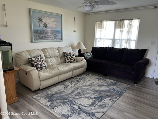 2781 Choctaw Dr, Melbourne, FL 32935 - living area with ceiling fan and wood finished floors