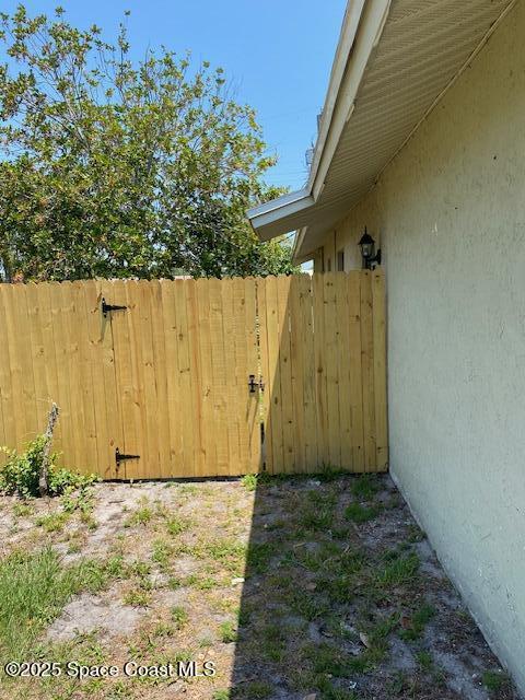 240 Perth Ave, Merritt Island, FL 32953 - view of yard featuring fence