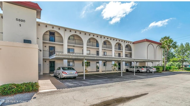 5800 N Banana River Blvd Unit 125, Cape Canaveral, FL 32920 - view of property featuring covered parking