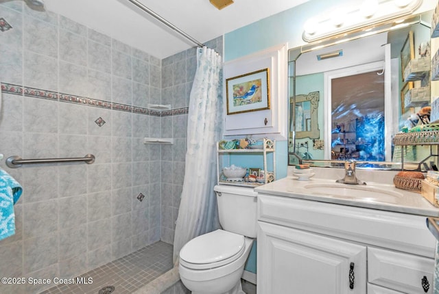 5800 N Banana River Blvd Unit 125, Cape Canaveral, FL 32920 - bathroom featuring tiled shower, toilet, and vanity