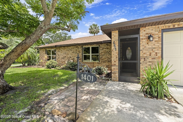 1401 Ruffin Cir SE, Palm Bay, FL 32909 - property entrance with brick siding, a yard, and a garage