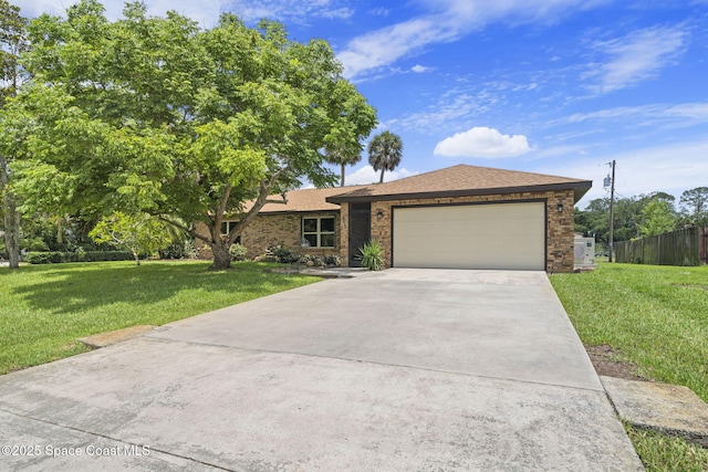 1401 Ruffin Cir SE, Palm Bay, FL 32909 - single story home with an attached garage, driveway, brick siding, and a shingled roof