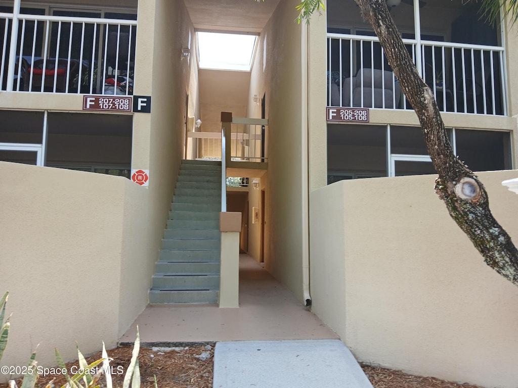 entrance to property with stucco siding