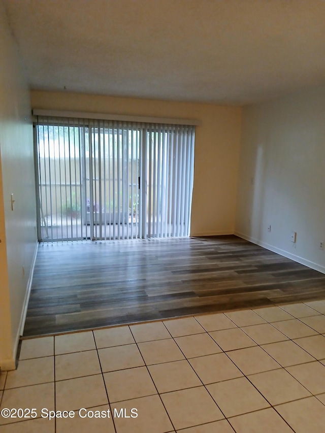 1600 Sunny Brook Ln NE Unit F106, Palm Bay, FL 32905 - empty room featuring wood finished floors and baseboards