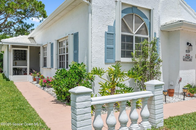 1924 Elderberry Ct NE, Palm Bay, FL 32905 - property entrance with stucco siding