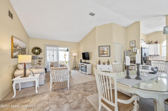 1924 Elderberry Ct NE, Palm Bay, FL 32905 - dining space with high vaulted ceiling, light colored carpet, and baseboards