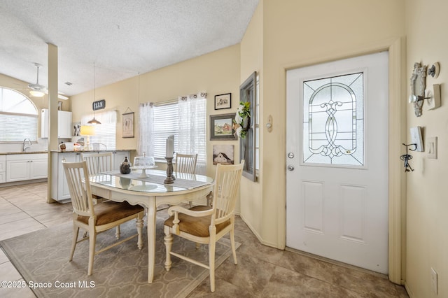1924 Elderberry Ct NE, Palm Bay, FL 32905 - dining room featuring a textured ceiling and light tile patterned floors
