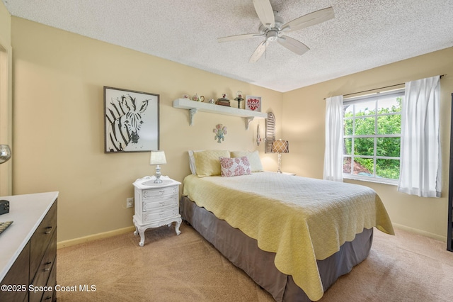 1924 Elderberry Ct NE, Palm Bay, FL 32905 - bedroom with light carpet, a textured ceiling, baseboards, and ceiling fan