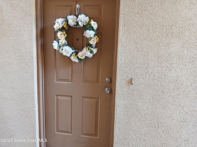 1600 Sunny Brook Ln NE Unit F108, Palm Bay, FL 32905 - view of exterior entry with stucco siding