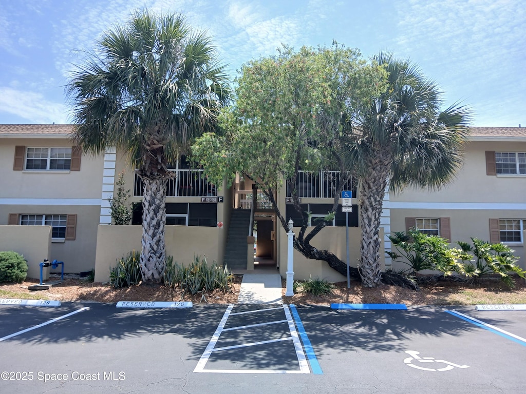 1600 Sunny Brook Ln NE Unit F108, Palm Bay, FL 32905 - view of property with uncovered parking