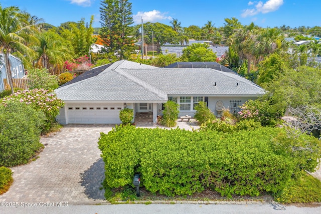544 Solitaire Palm Dr, Indialantic, FL 32903 - ranch-style home featuring an attached garage and decorative driveway