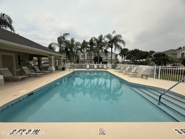 601 Trotter Ln Unit 102, Melbourne, FL 32940 - community pool with a patio area