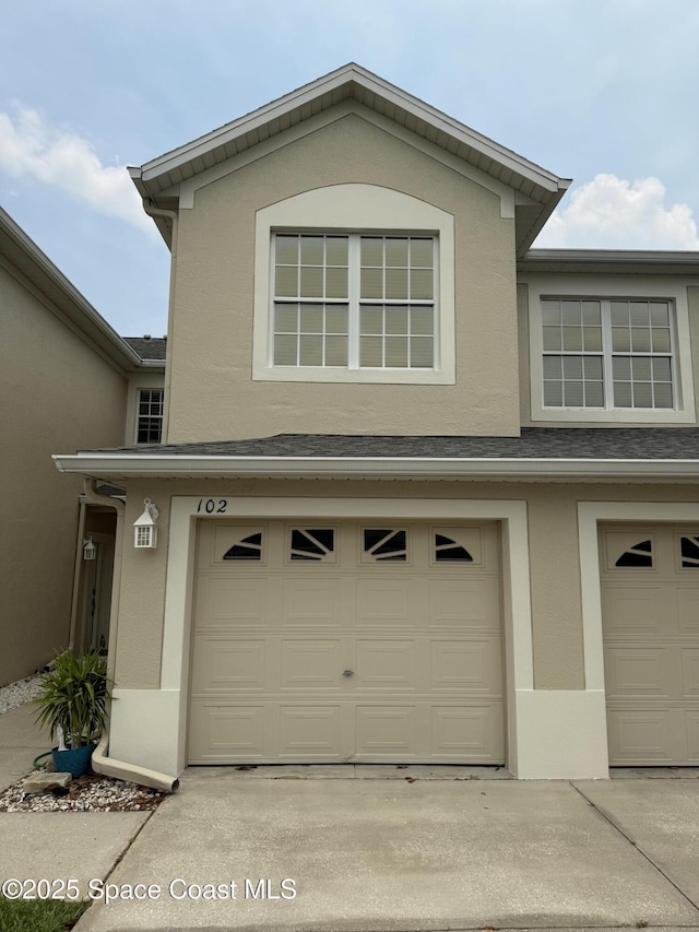 601 Trotter Ln Unit 102, Melbourne, FL 32940 - garage with driveway