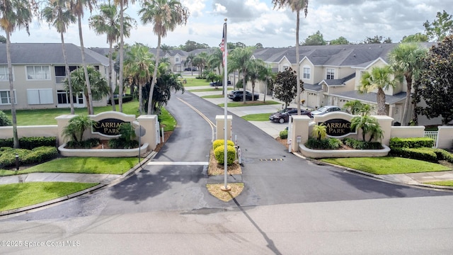 601 Trotter Ln Unit 102, Melbourne, FL 32940 - view of asphalt road with a residential view and curbs