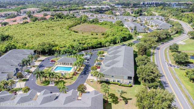 601 Trotter Ln Unit 102, Melbourne, FL 32940 - aerial perspective of suburban area with a pool area