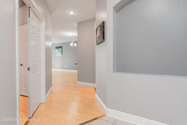 601 Trotter Ln Unit 102, Melbourne, FL 32940 - corridor with baseboards and light wood-type flooring