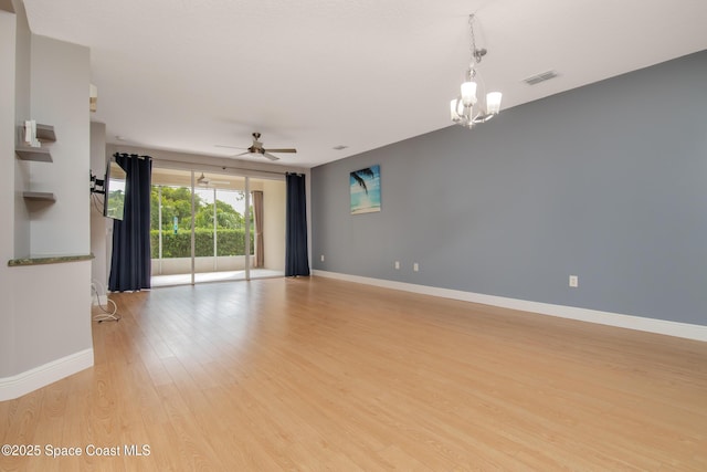 601 Trotter Ln Unit 102, Melbourne, FL 32940 - unfurnished room with light wood-type flooring, a chandelier, ceiling fan, and baseboards