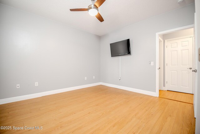 601 Trotter Ln Unit 102, Melbourne, FL 32940 - spare room with a ceiling fan, light wood-type flooring, and baseboards