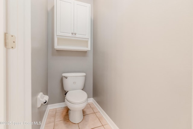 601 Trotter Ln Unit 102, Melbourne, FL 32940 - bathroom featuring tile patterned flooring, toilet, and baseboards