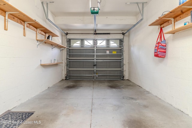601 Trotter Ln Unit 102, Melbourne, FL 32940 - garage featuring a garage door opener