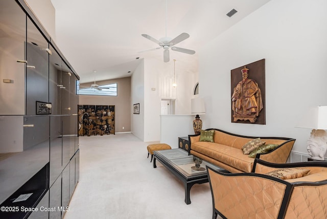 1444 Patriot Dr, Melbourne, FL 32940 - living area featuring a ceiling fan, lofted ceiling, light carpet, and baseboards