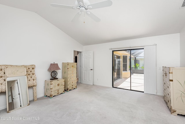 1444 Patriot Dr, Melbourne, FL 32940 - unfurnished bedroom featuring access to outside, vaulted ceiling, carpet floors, baseboards, and a ceiling fan