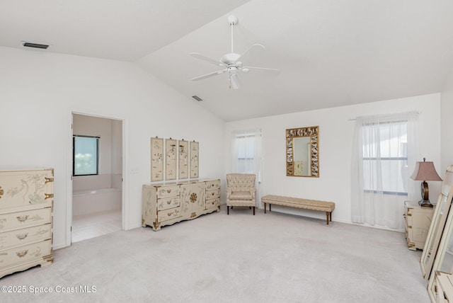 1444 Patriot Dr, Melbourne, FL 32940 - bedroom with vaulted ceiling, light colored carpet, connected bathroom, and ceiling fan