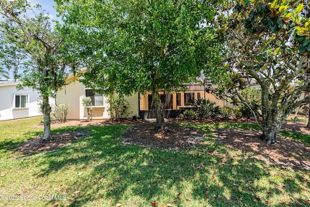 1444 Patriot Dr, Melbourne, FL 32940 - view of front of house featuring a front lawn and stucco siding