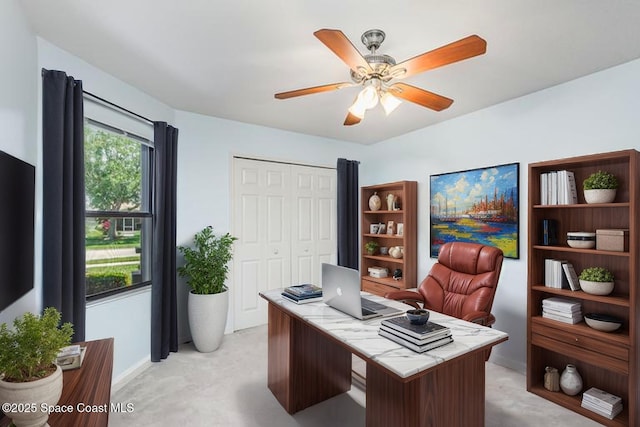 1444 Patriot Dr, Melbourne, FL 32940 - office with light colored carpet, a ceiling fan, and baseboards
