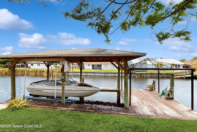 2180 Dumas St, Merritt Island, FL 32952 - dock area featuring boat lift and a water view