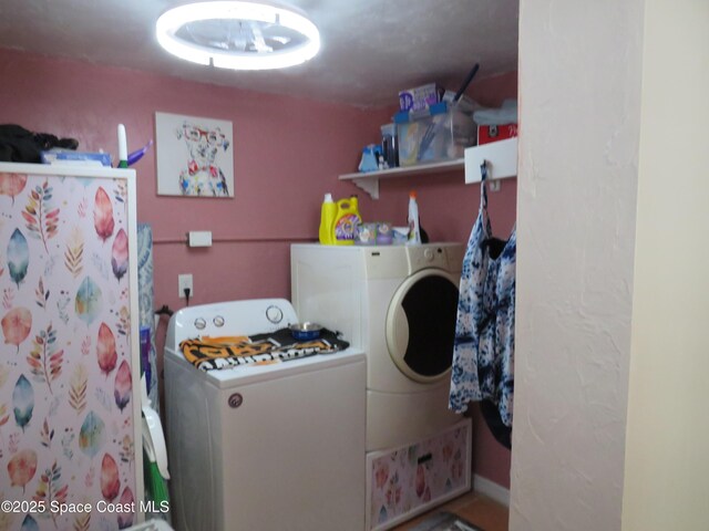 4535 Moon Rd, Titusville, FL 32780 - clothes washing area featuring washing machine and dryer