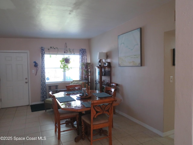 4535 Moon Rd, Titusville, FL 32780 - dining room featuring baseboards and light tile patterned floors