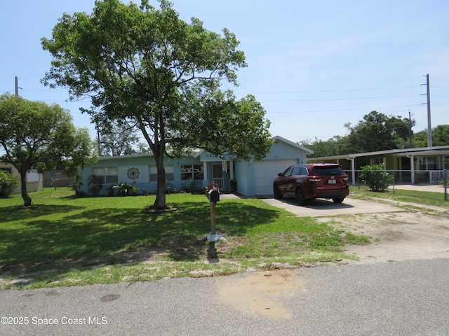 4535 Moon Rd, Titusville, FL 32780 - view of front of house with a garage, driveway, and a front lawn