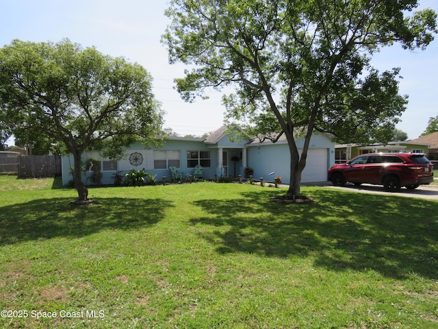 4535 Moon Rd, Titusville, FL 32780 - view of front facade featuring a garage and driveway