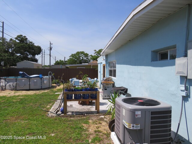 4535 Moon Rd, Titusville, FL 32780 - view of yard with central AC and a patio area
