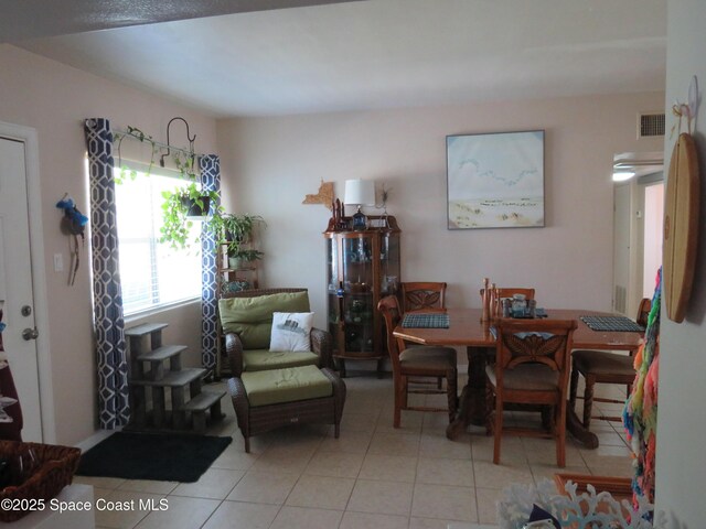 4535 Moon Rd, Titusville, FL 32780 - dining area with light tile patterned floors