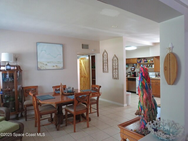 4535 Moon Rd, Titusville, FL 32780 - dining area with light tile patterned floors and baseboards