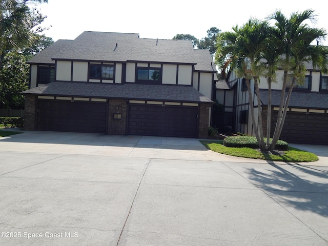 865 Greenwood Manor Cir Unit 5-F, West Melbourne, FL 32904 - english style home featuring driveway, an attached garage, and brick siding