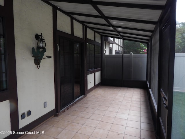 865 Greenwood Manor Cir Unit 5-F, West Melbourne, FL 32904 - unfurnished sunroom with beamed ceiling