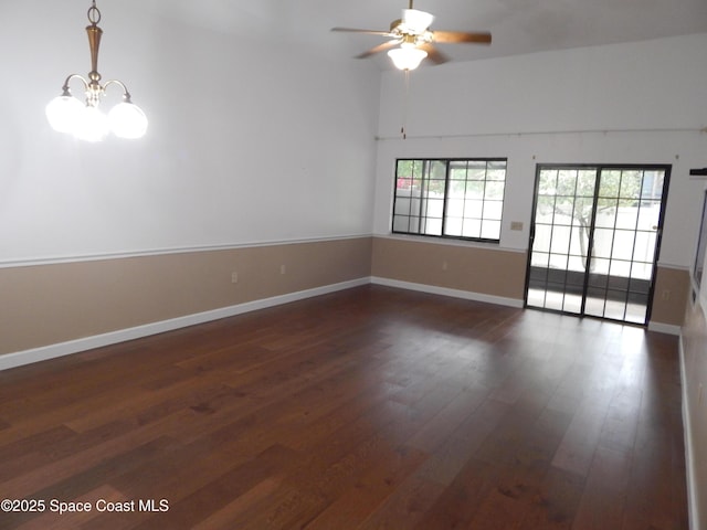 865 Greenwood Manor Cir Unit 5-F, West Melbourne, FL 32904 - spare room featuring dark wood finished floors, a ceiling fan, baseboards, and a chandelier