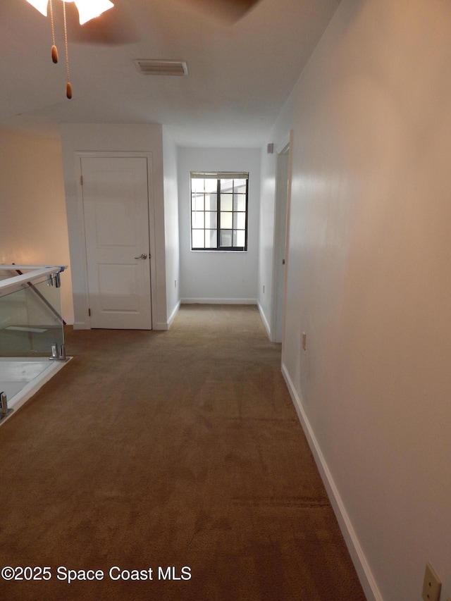 865 Greenwood Manor Cir Unit 5-F, West Melbourne, FL 32904 - hallway with carpet and baseboards