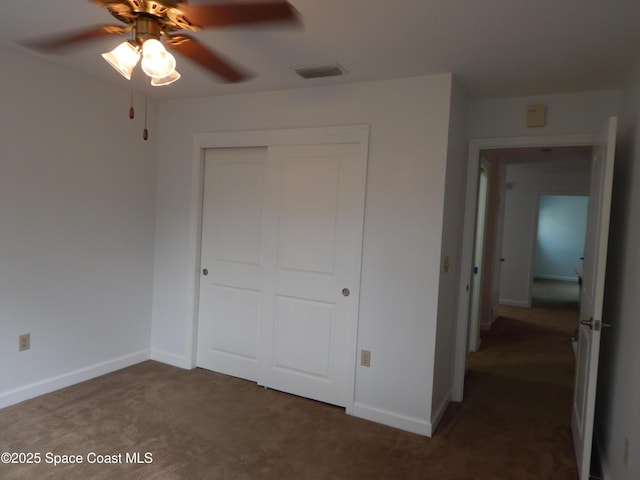 865 Greenwood Manor Cir Unit 5-F, West Melbourne, FL 32904 - unfurnished bedroom with carpet, a closet, baseboards, and ceiling fan