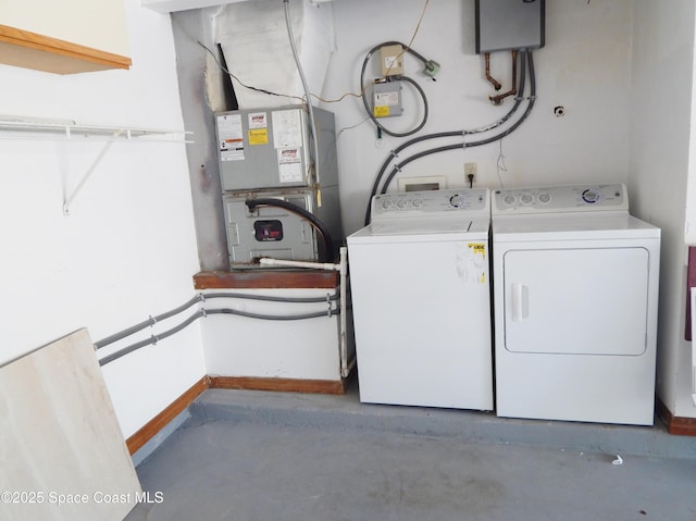 865 Greenwood Manor Cir Unit 5-F, West Melbourne, FL 32904 - laundry area featuring separate washer and dryer, baseboards, and heating unit