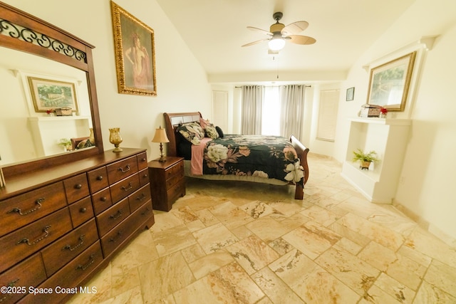 bedroom featuring ceiling fan and lofted ceiling